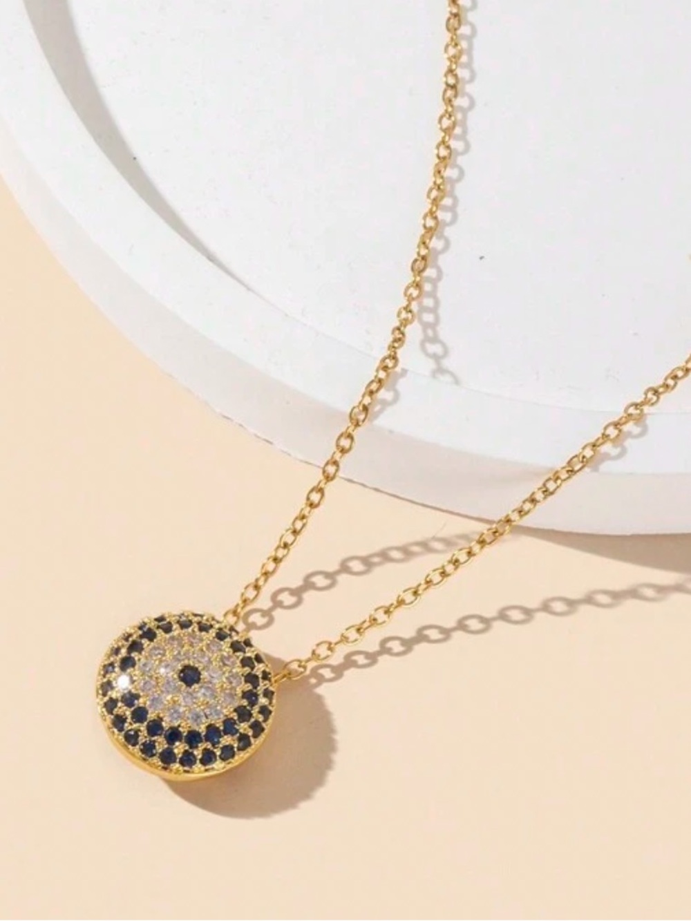 Gold Circle Pendant Necklace with Blue and White Stones